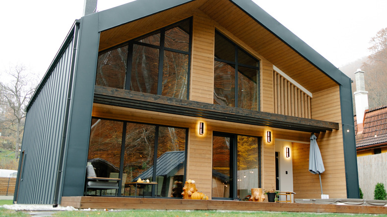 Wood cladding lines a beautiful rustic-meets-modern home.
