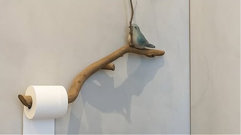 An elegant toilet paper holder crafted from a real tree branch