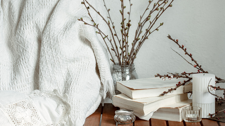 Spring arrangement with books and willow branches