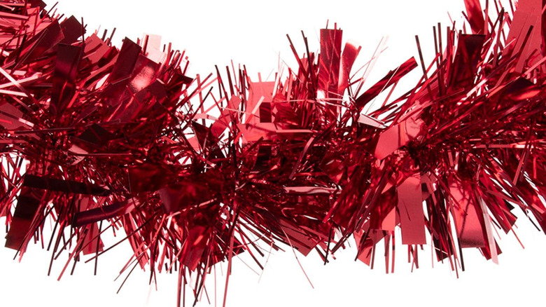 Close-up of strand of red tinsel garland