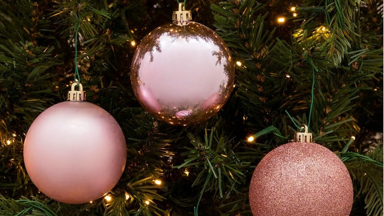 pink Christmas ball ornaments hanging on tree