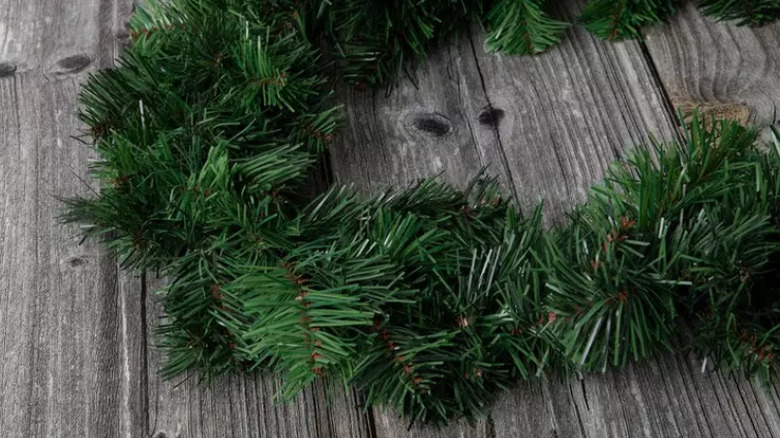 strand of faux garland on a wooden surface