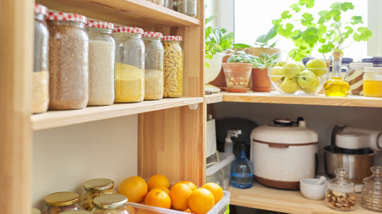 kitchen pantry with wooden shelves