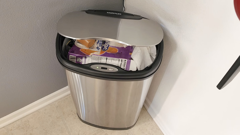 automated trash can slightly open