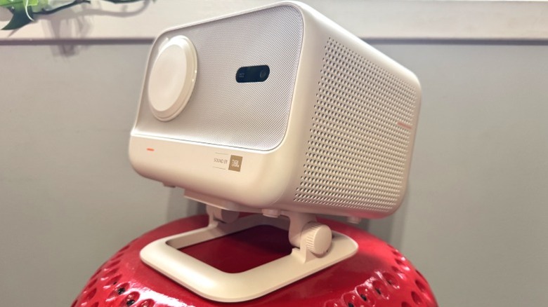 Yarber L2 Plus projector pointed up sitting on strawberry stand