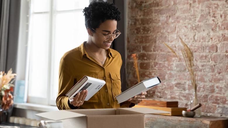 woman packing books