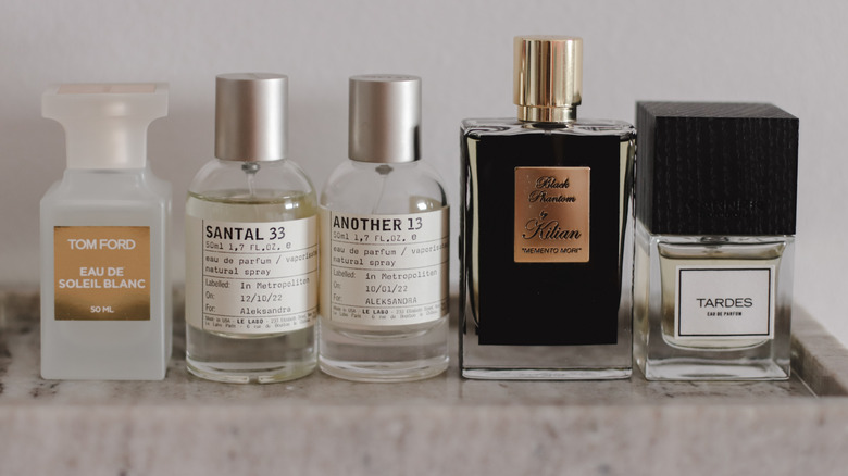 A collection of perfume bottles lined up