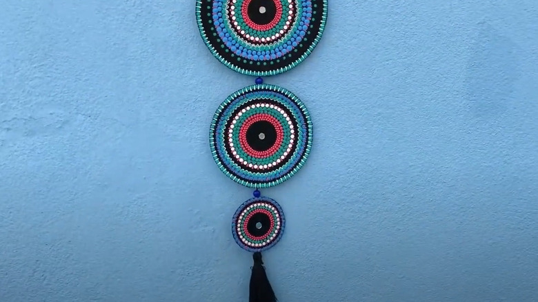 Handmade hanging striped cardboard mandalas with tassel