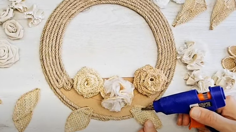 Handmade rustic cardboard flower wreath with burlap and twine accents