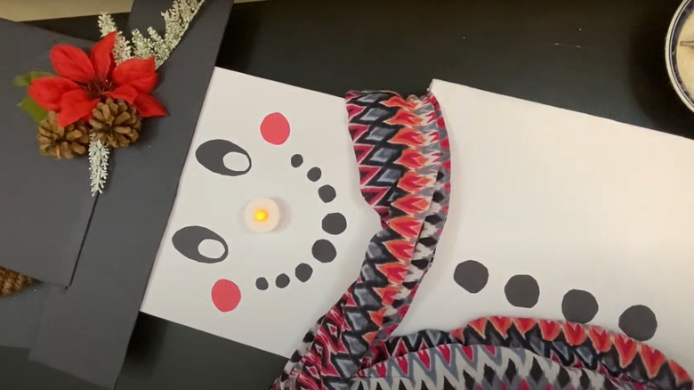 DIY pizza box snowman with light-up nose and accessories