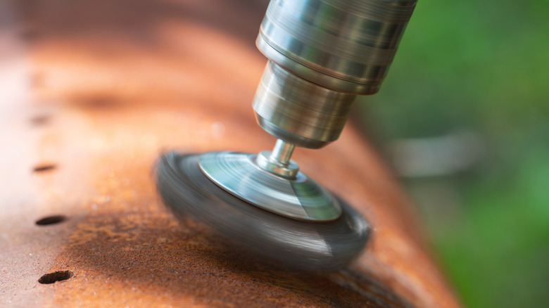 drill powdered grinder on metal