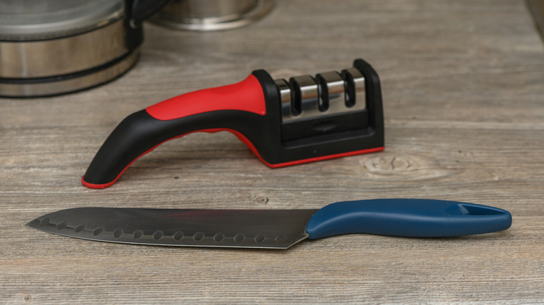 knife beside sharpener in kitchen