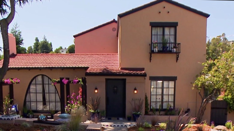 The exterior of a traditional Queen Anne house.