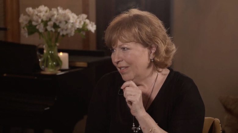 Joan Steffend sitting on a couch for an interview