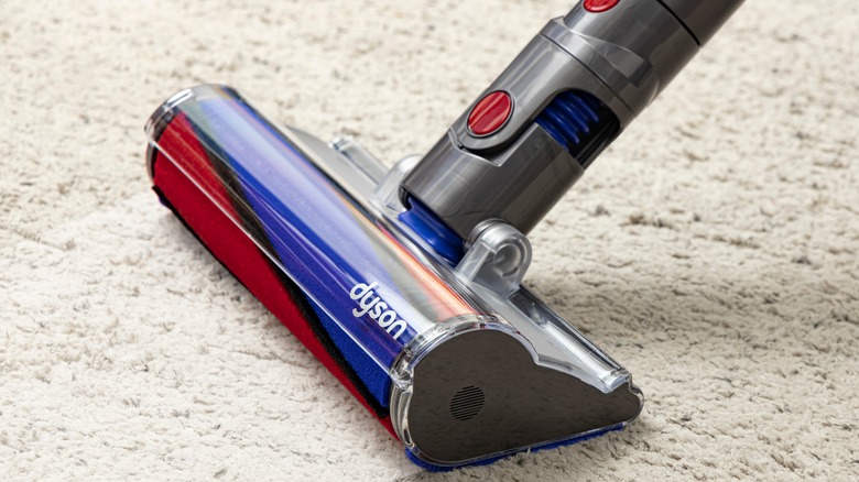 Dyson vacuum on light gray carper