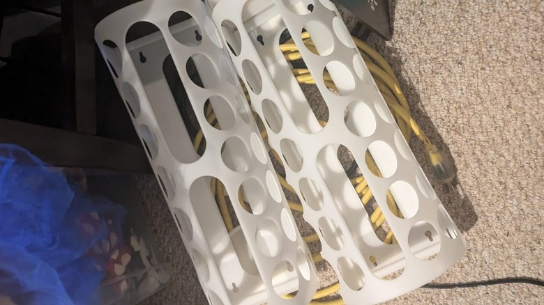 IKEA VARIERA plastic bag organizers on top of cables.