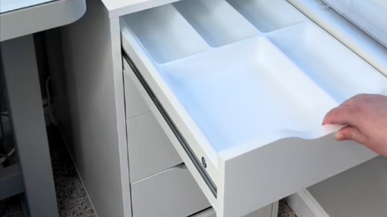 IKEA flatware organizer inside desk drawer