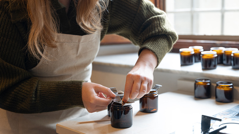 Woman making soy candle