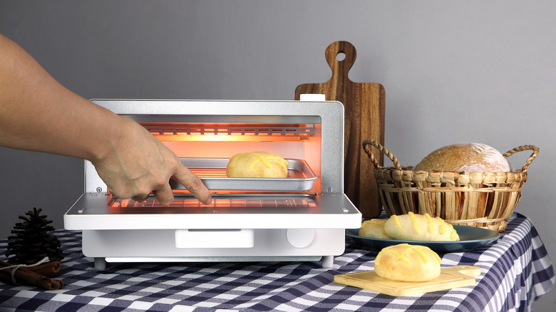 placing food in toaster oven