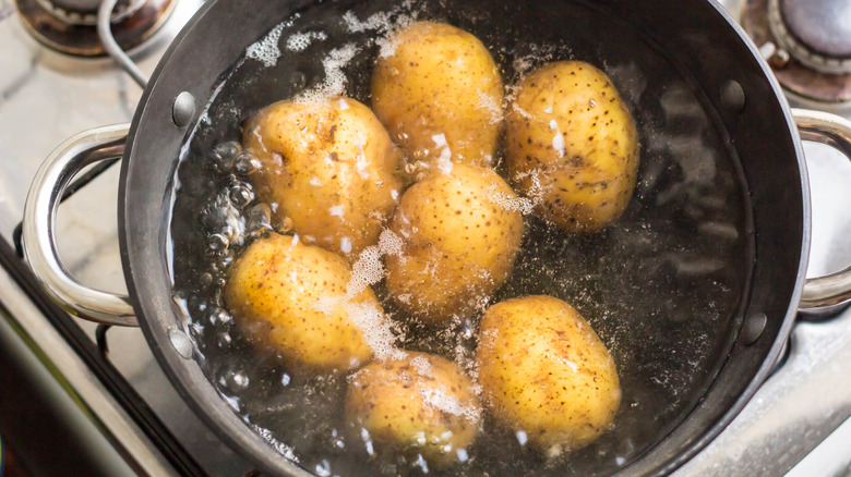 Boiling potatoes on stove 