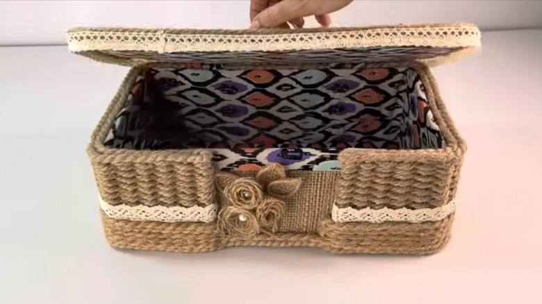 Shoe box turned into a storage basket with rope