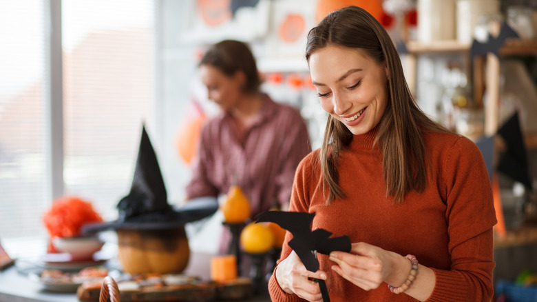 Women crafting Halloween decorations