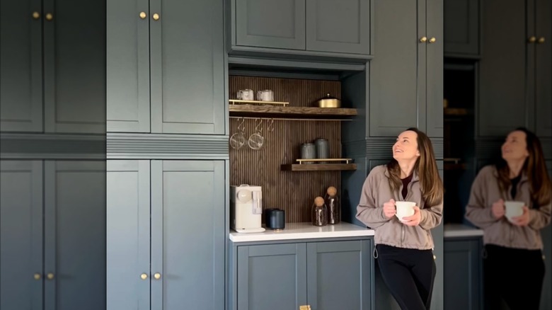 Woman standing in front of DIY custom built-in coffee bar