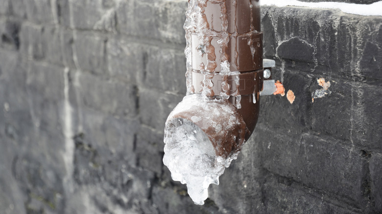 An exterior pipe that's frozen over with ice