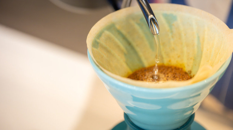 A blue ceramic pour-over coffee basket