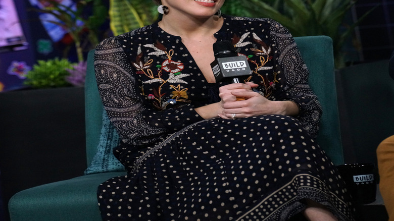 Erin Napier listening and smiling during an interview