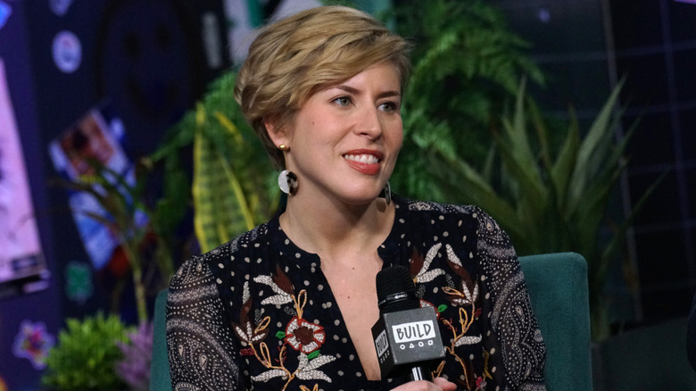 Erin Napier listening and smiling during an interview