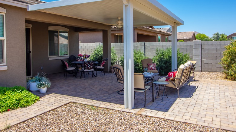 Patio with a dry gravel area surrounding it