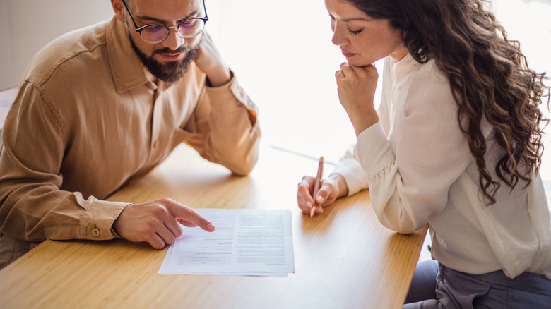 A couple going through a contract together