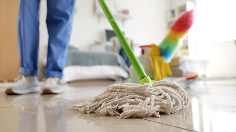 Person mopping their floors to a shine with all-natural cleaning ingredient, glycerin.