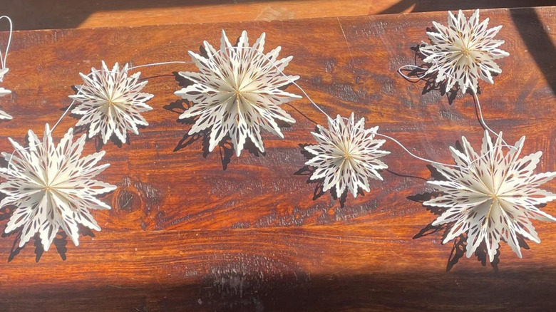 A garland made from thin wire and details snowflakes with a 3D texture