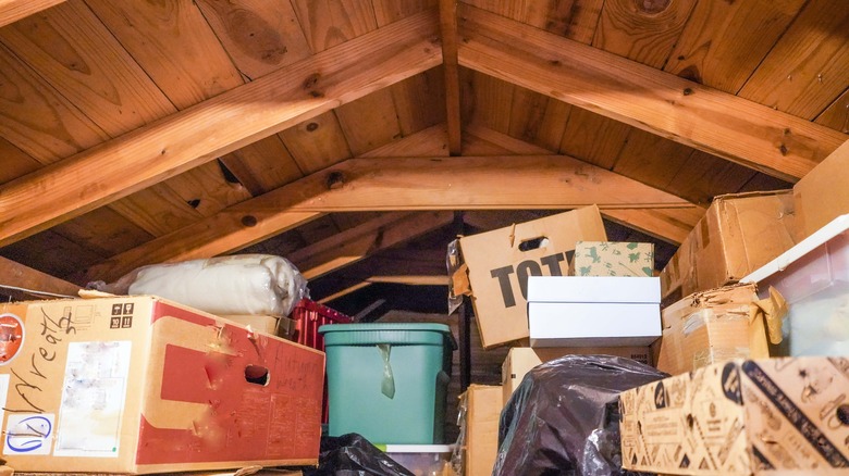 Attic with storage bins and boxes