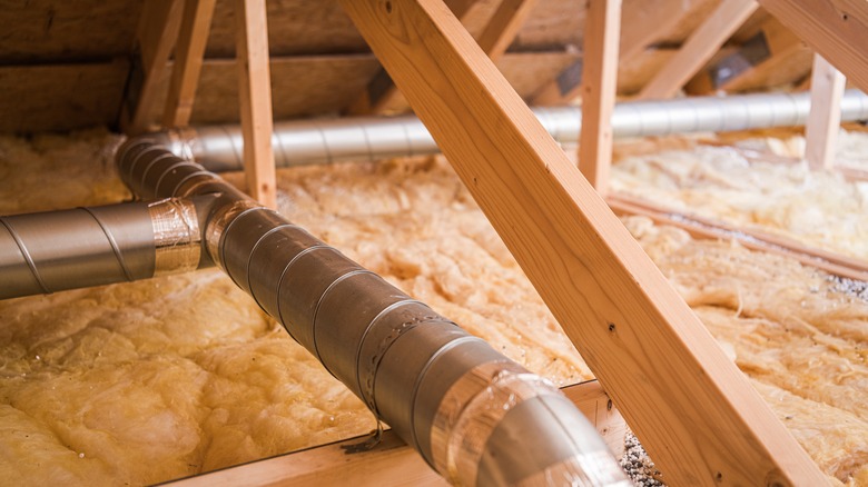 Attic with proper insulation and well-structured ventilation pipes