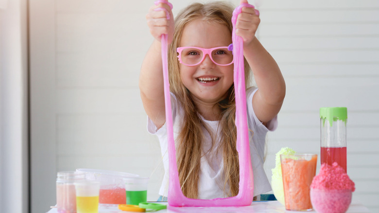 Kid playing with slime