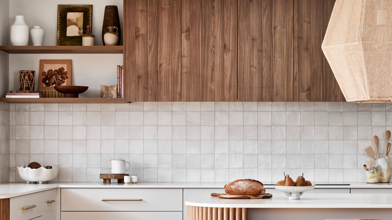 A modern boho style kitchen with white zellige tile backsplash