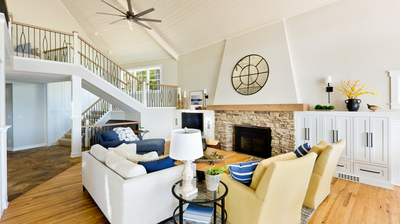 living room with subtle beach details like blue accents and striped pillows