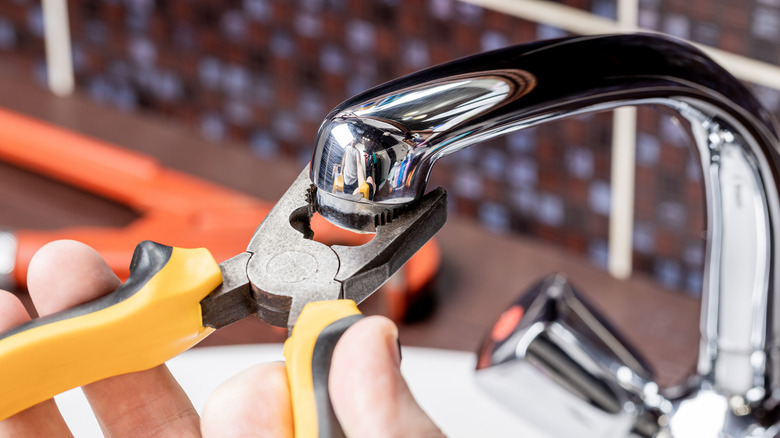 Adjusting a tap leak using a wrench