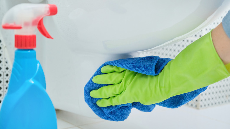 cleaning base of toilet