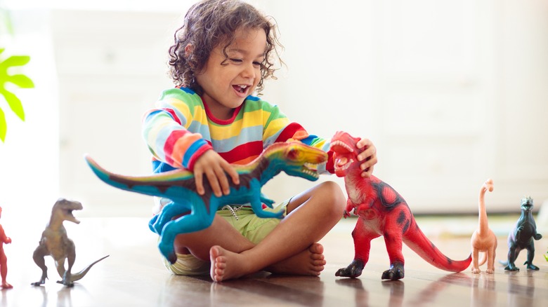 Kid playing with toys