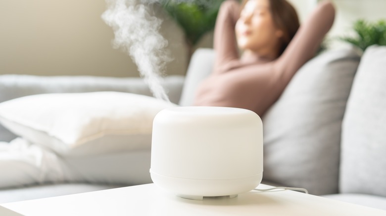 Woman using humidifier