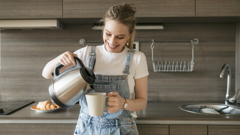 woman with electric kettle