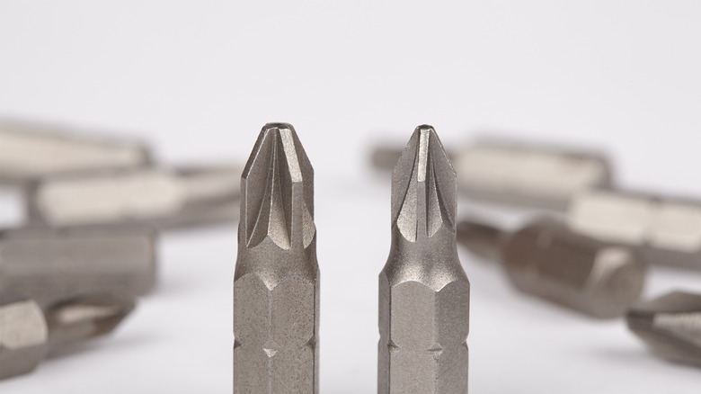Two Pozidriv screwdriver bits of different sizes