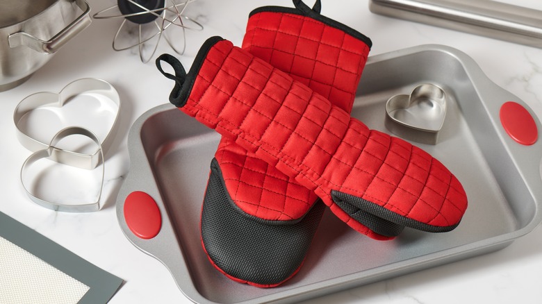 Silicone oven mitts on tray