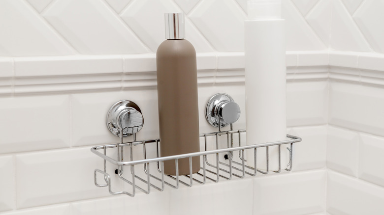 https://www.housedigest.com/img/gallery/youve-been-missing-out-on-the-best-shower-caddy-feature-for-secured-bathroom-storage/intro-1699189393.jpg