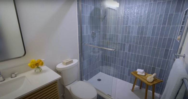 bathroom with vertical blue tile