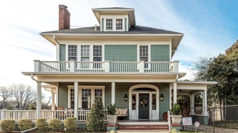 pale green and large house
